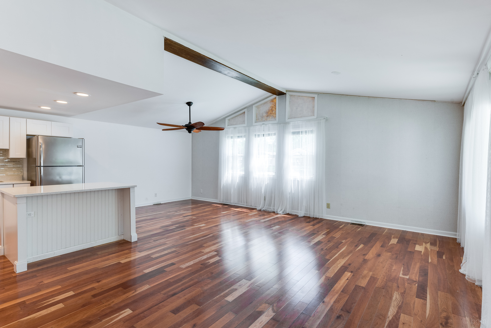 1110 Lakewood Road Elgin, IL 60123 - Photo 4 of 24 a view of empty room with wooden floor and window