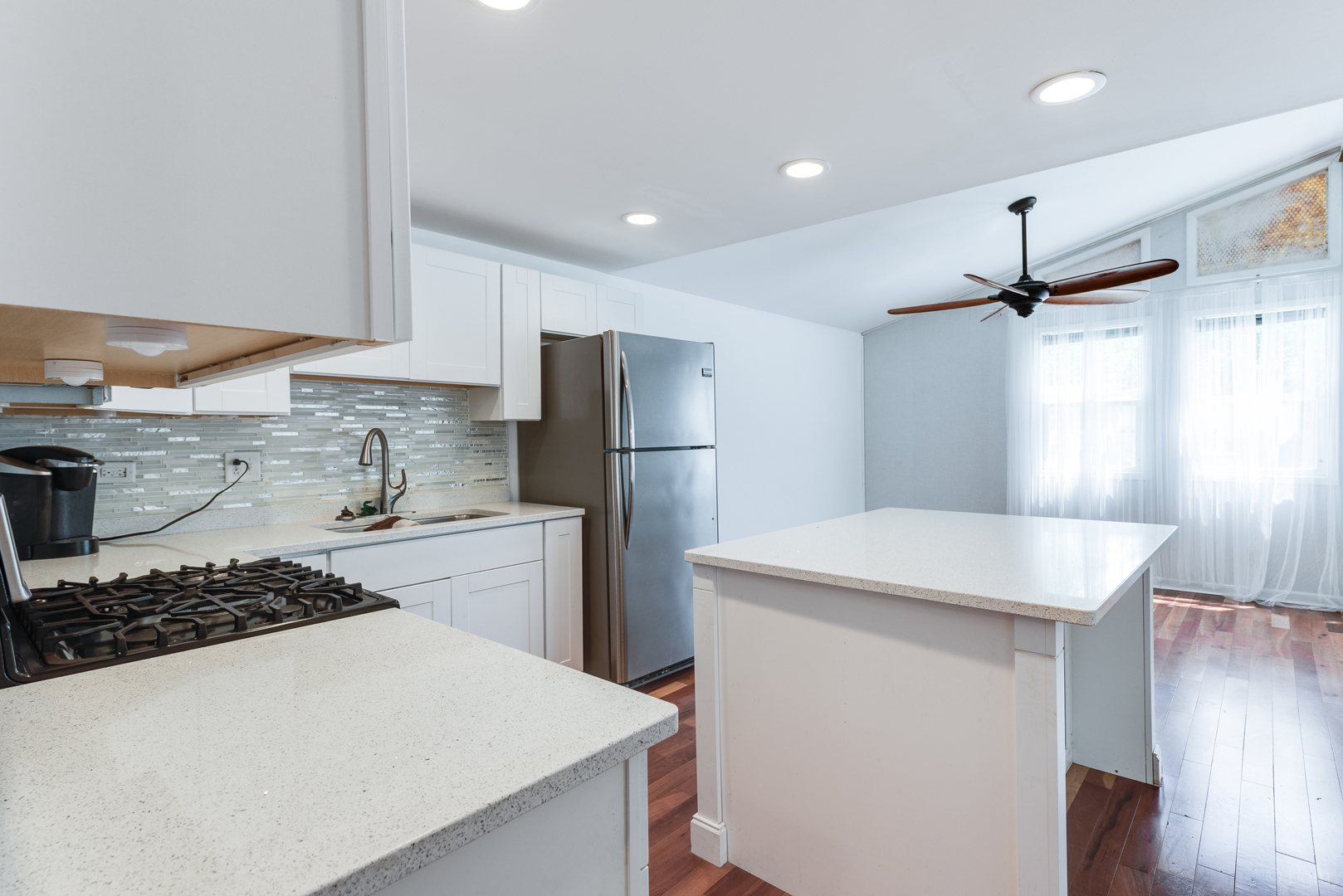 1110 Lakewood Road Elgin, IL 60123 - Photo 7 of 24 a kitchen with a refrigerator a sink and a stove