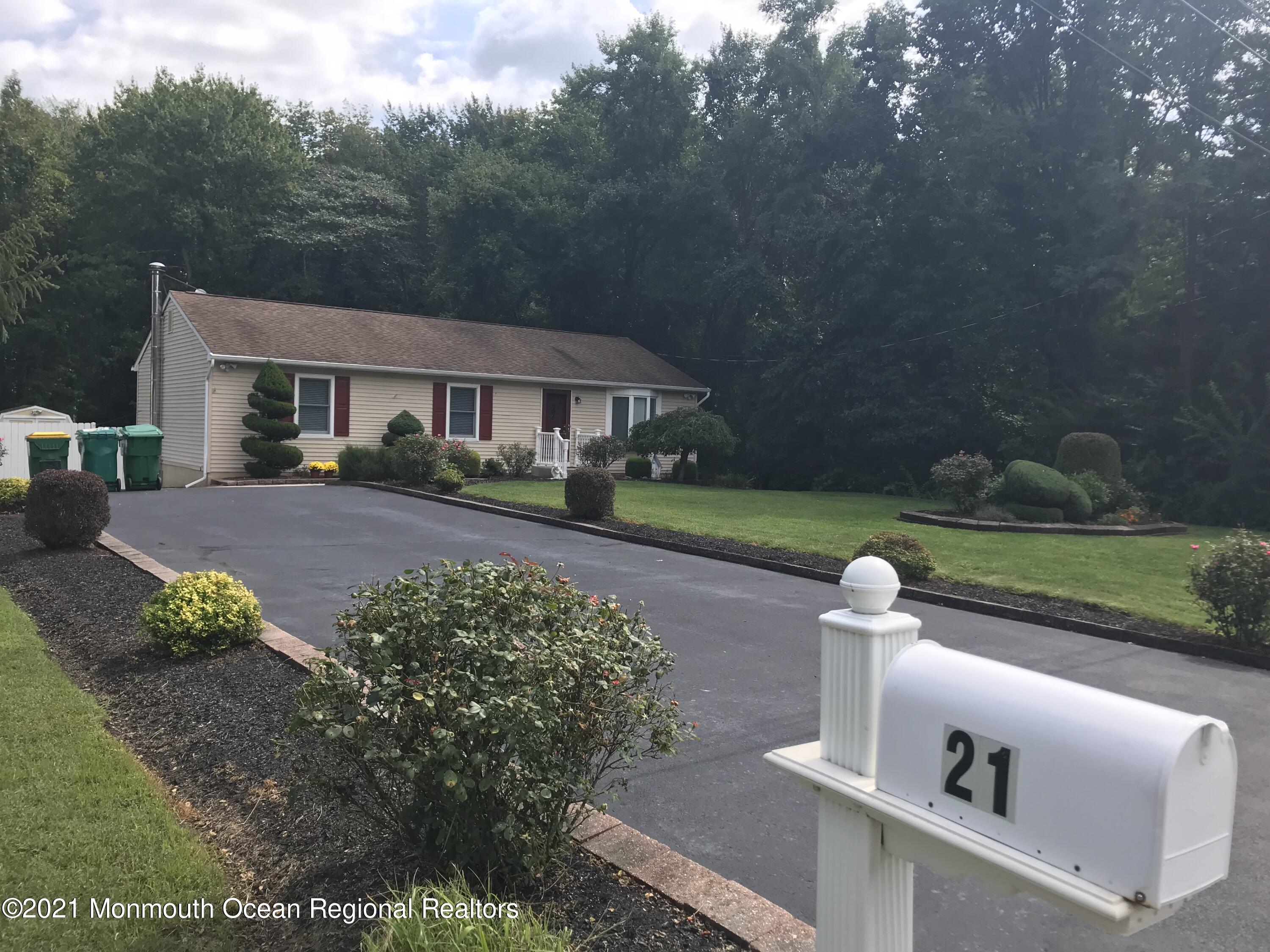 21 Kuzyk Road Cream Ridge, NJ 08514 - Photo 1 of 45 a front view of a house with garden