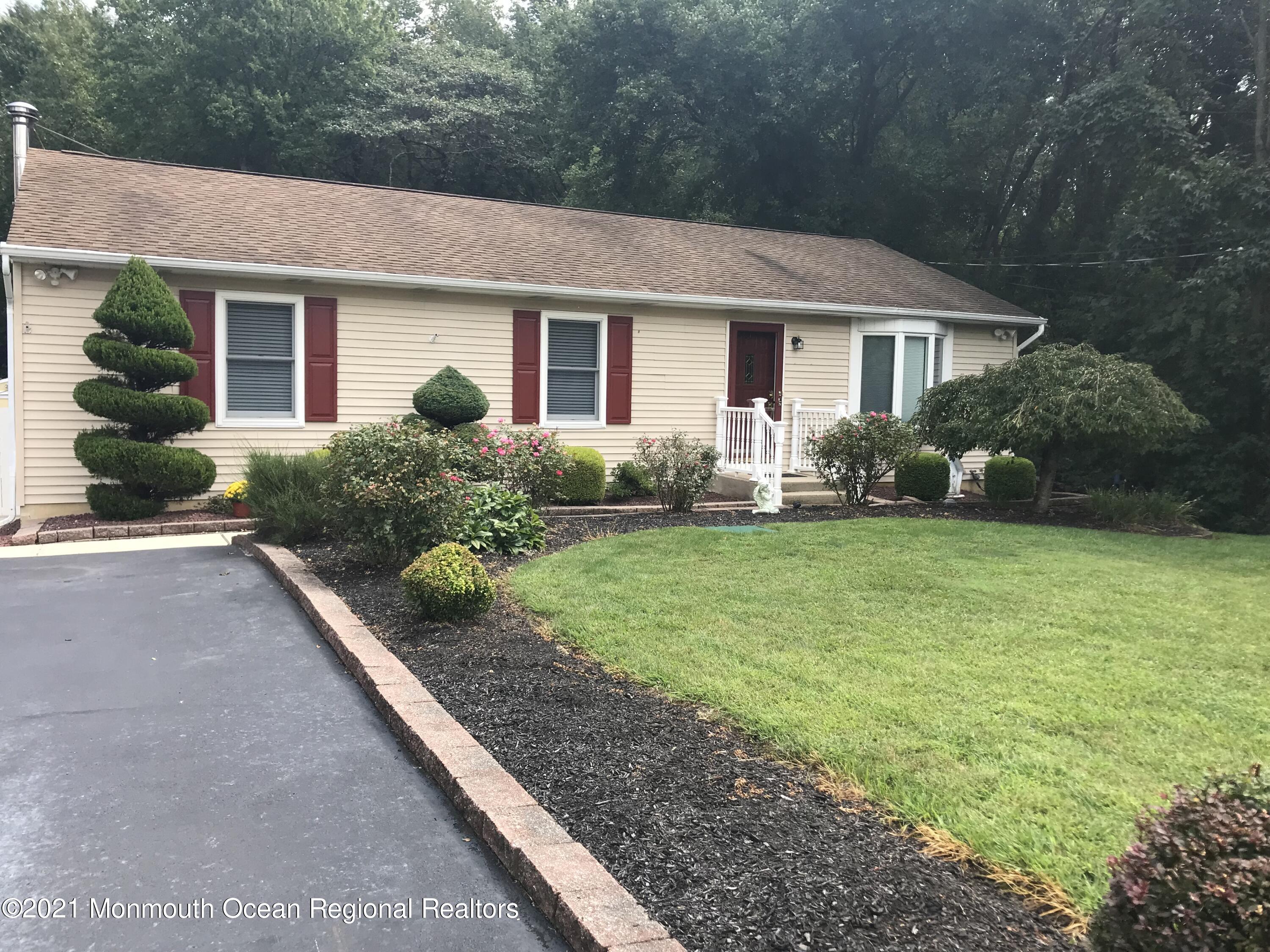 21 Kuzyk Road Cream Ridge, NJ 08514 - Photo 2 of 45 a front view of house with yard and green space