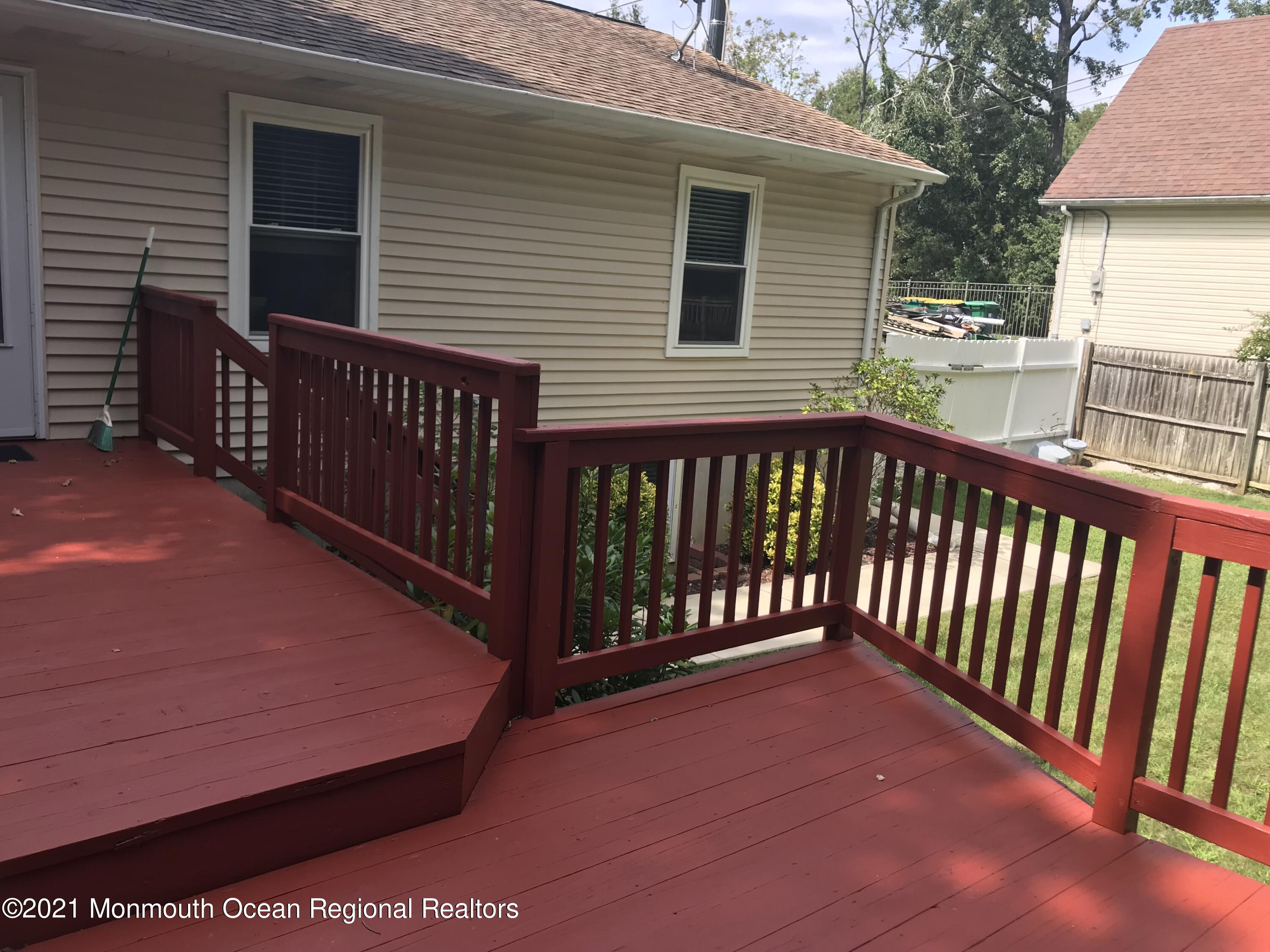 21 Kuzyk Road Cream Ridge, NJ 08514 - Photo 11 of 45 a view of a deck with a barbeque grill and wooden fence