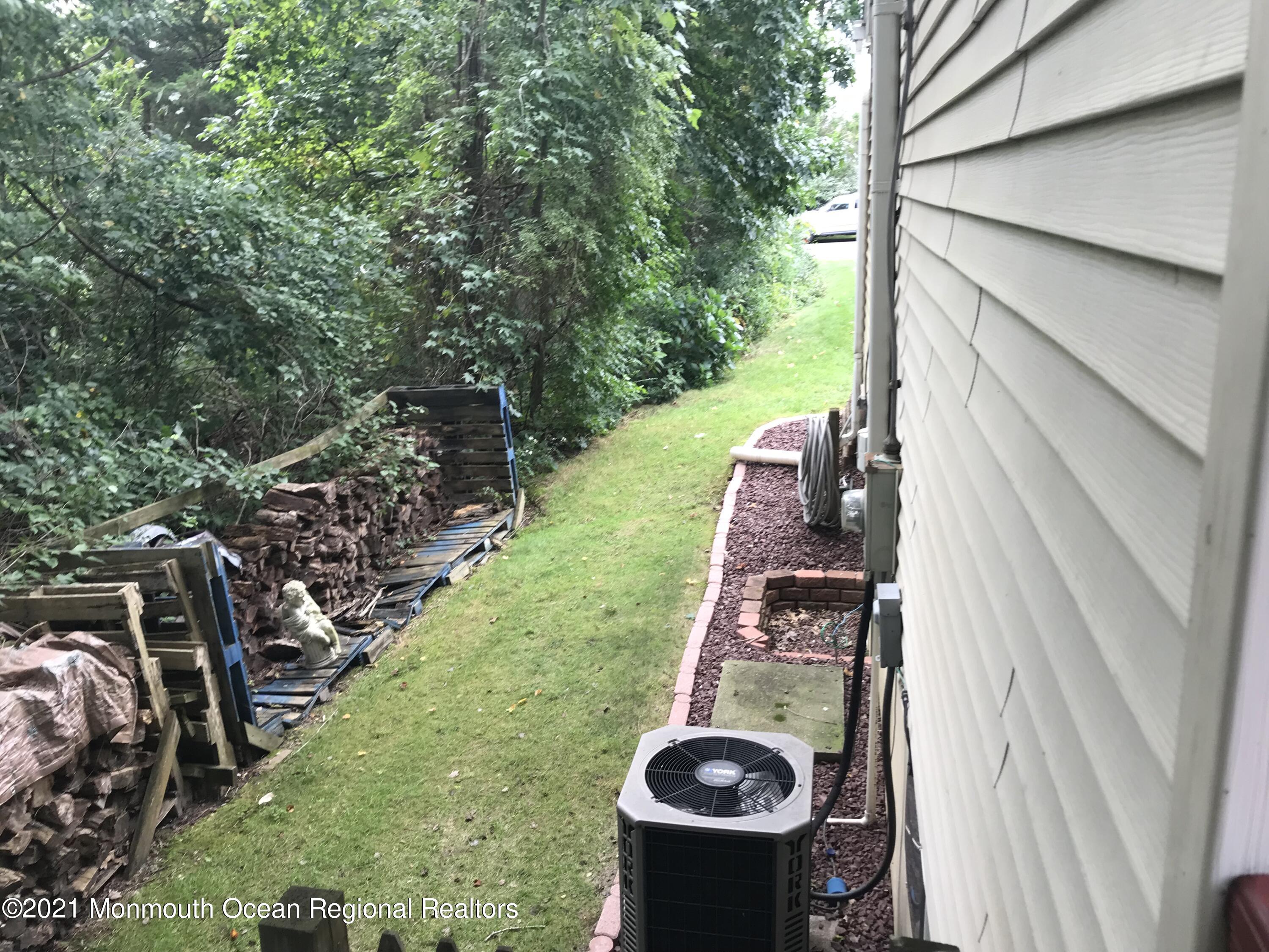21 Kuzyk Road Cream Ridge, NJ 08514 - Photo 13 of 45 a view of a backyard with sitting area