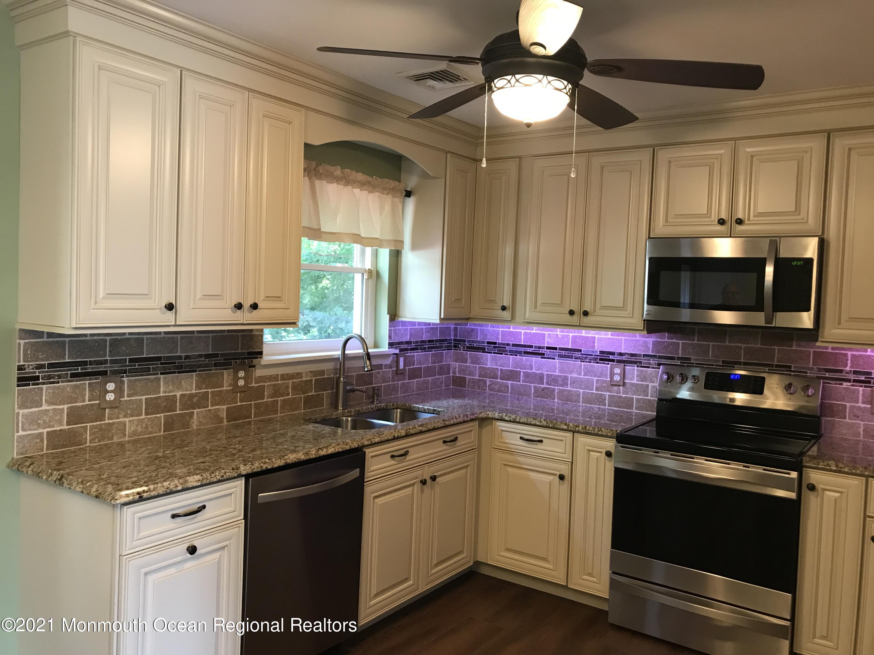 21 Kuzyk Road Cream Ridge, NJ 08514 - Photo 18 of 45 a kitchen with a sink stove and microwave