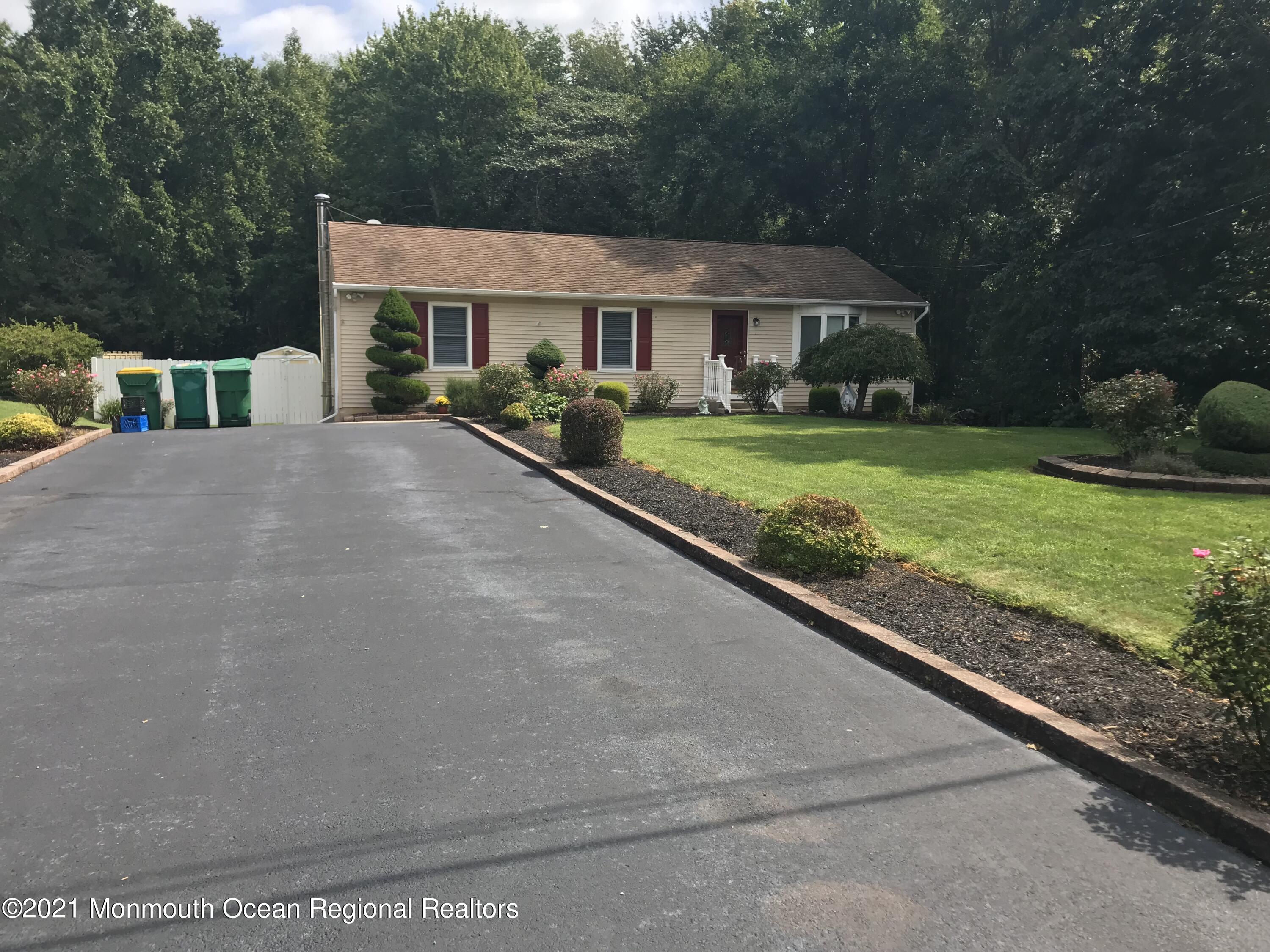 21 Kuzyk Road Cream Ridge, NJ 08514 - Photo 3 of 45 a front view of a house with a yard