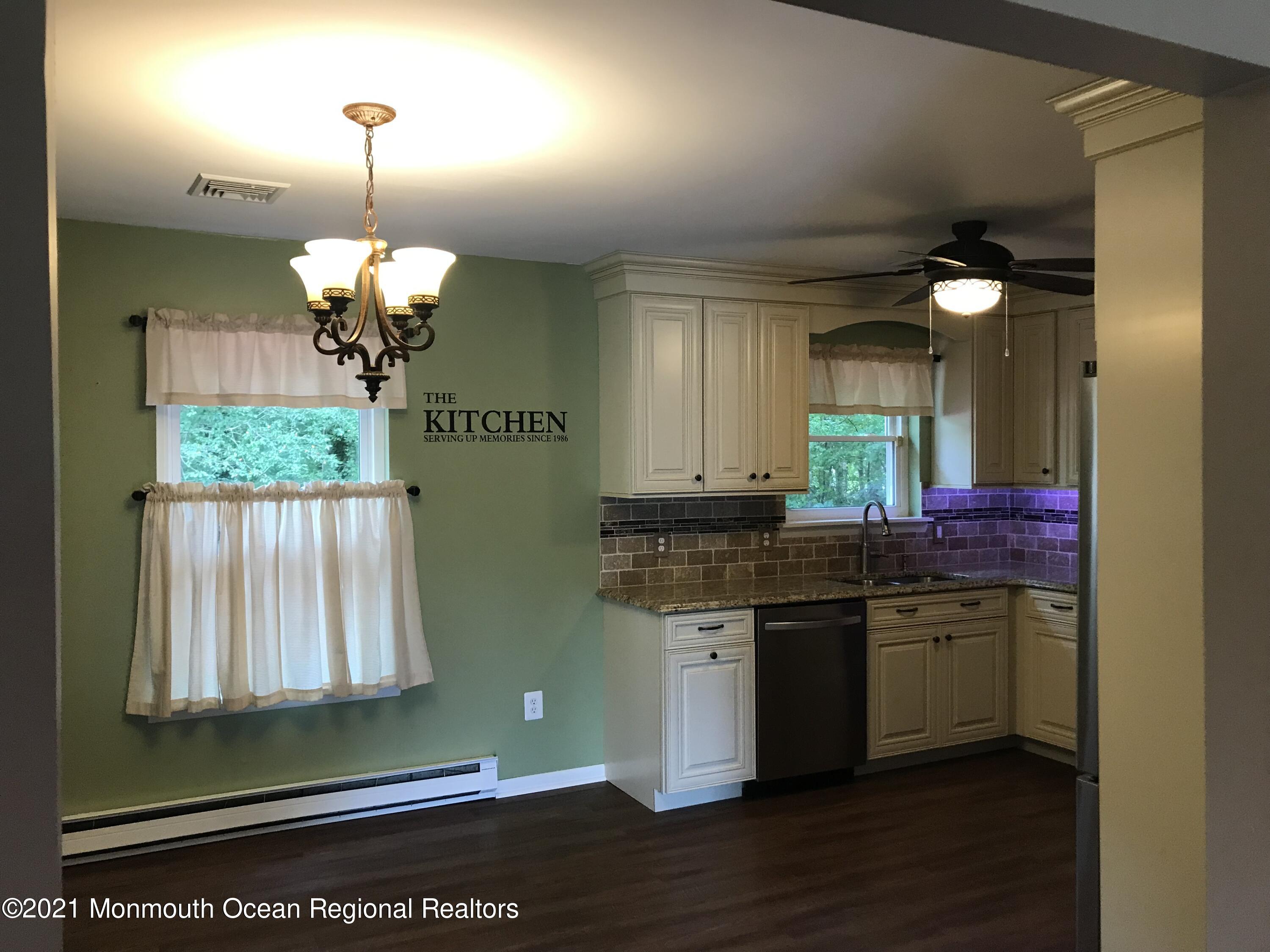 21 Kuzyk Road Cream Ridge, NJ 08514 - Photo 21 of 45 a kitchen with a sink and chandelier