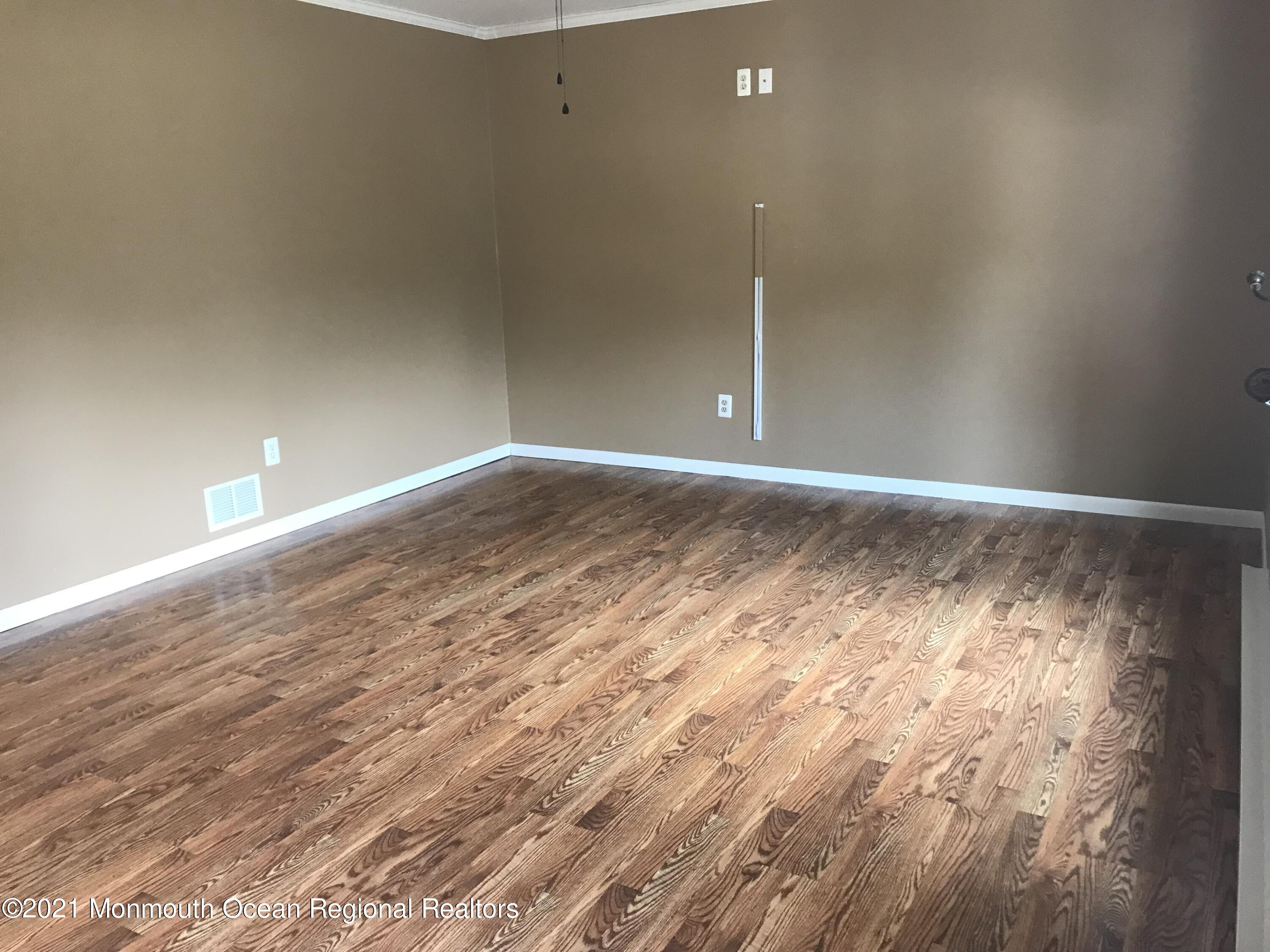 21 Kuzyk Road Cream Ridge, NJ 08514 - Photo 25 of 45 a view of empty room with wooden floor