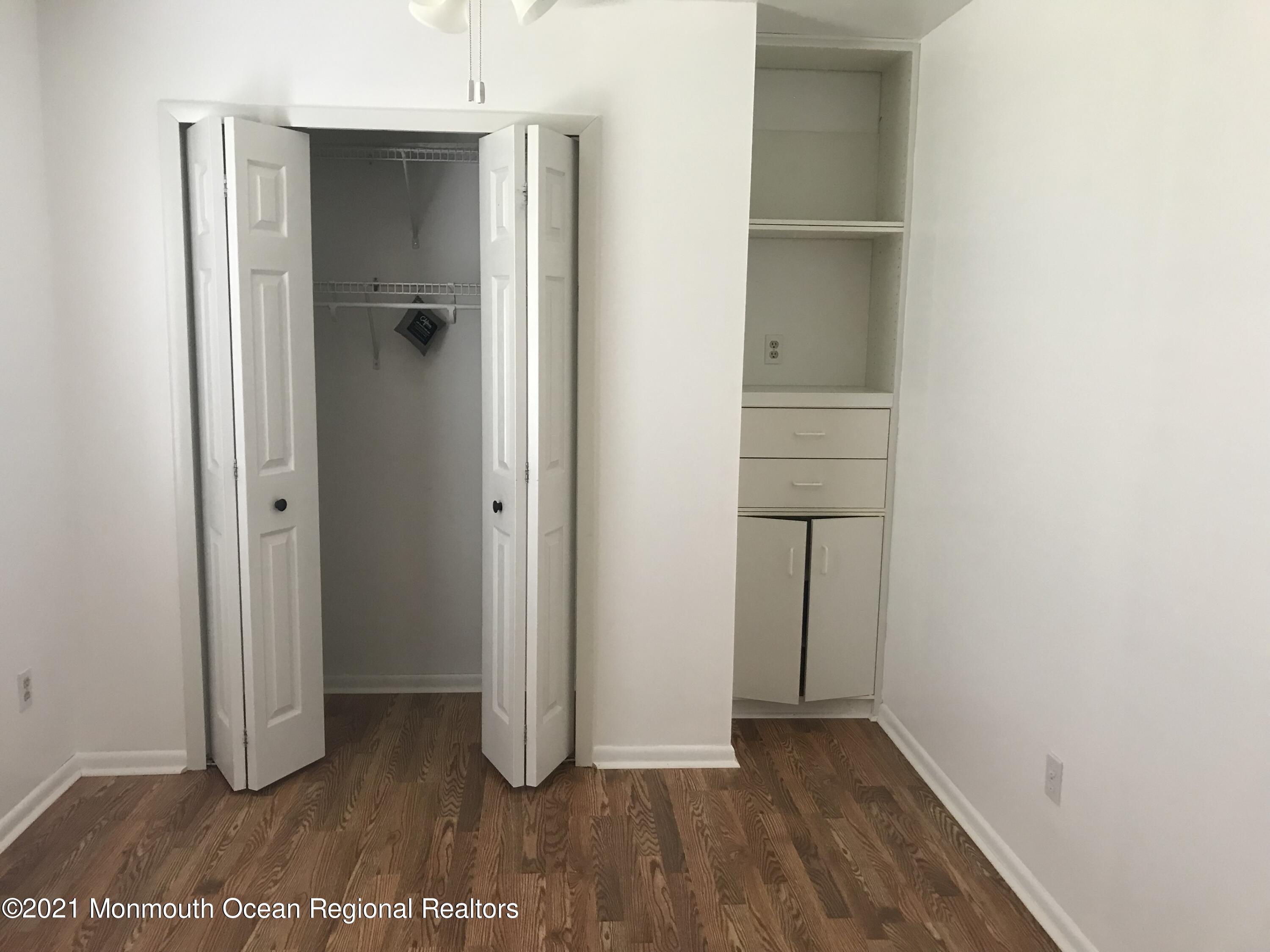 21 Kuzyk Road Cream Ridge, NJ 08514 - Photo 32 of 45 a view of an empty room with closet and wooden floor