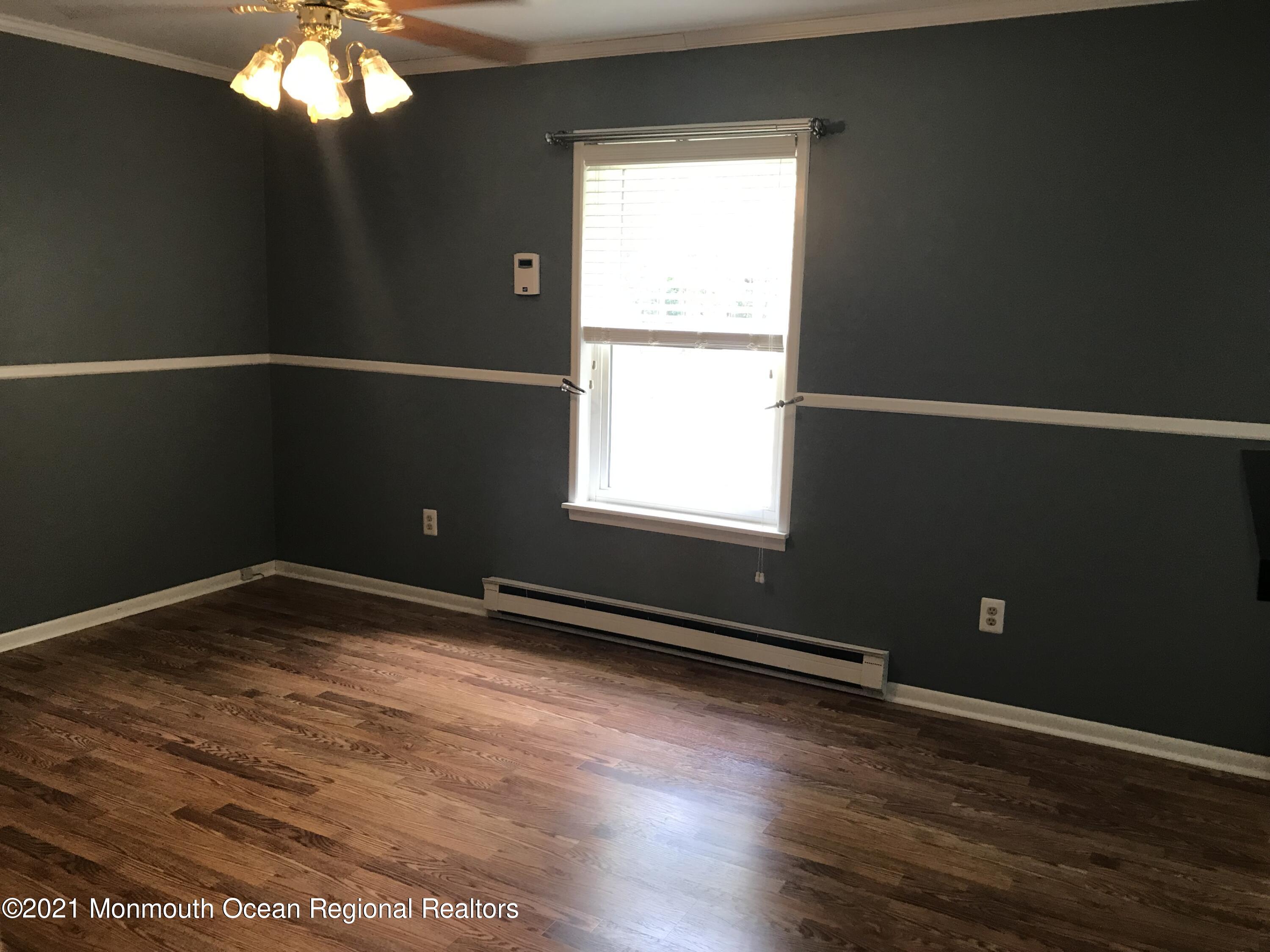 21 Kuzyk Road Cream Ridge, NJ 08514 - Photo 35 of 45 a view of an empty room with wooden floor and a window