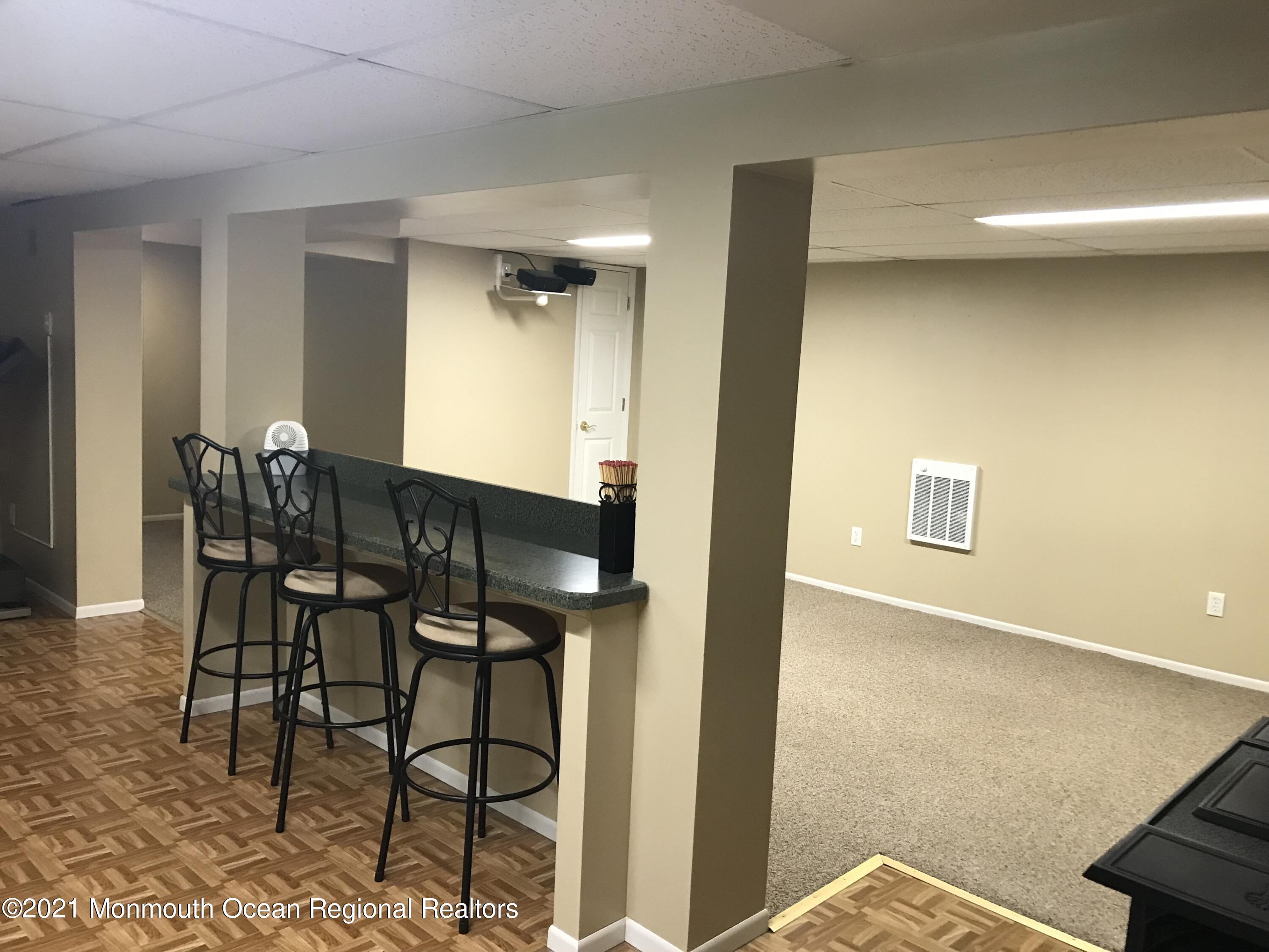21 Kuzyk Road Cream Ridge, NJ 08514 - Photo 43 of 45 a view of a dining room with furniture and a potted plant