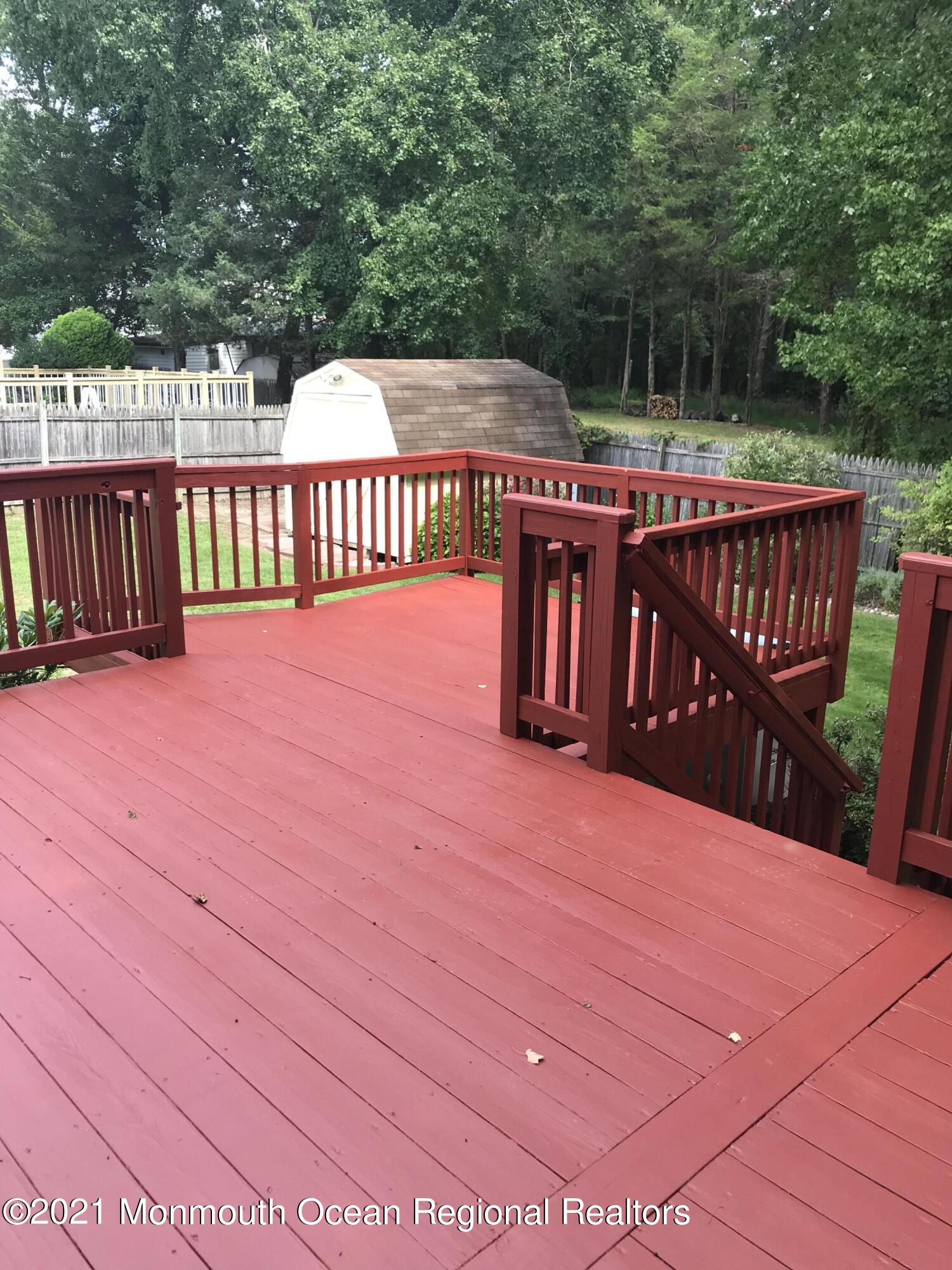 21 Kuzyk Road Cream Ridge, NJ 08514 - Photo 10 of 45 a view of a deck with a yard