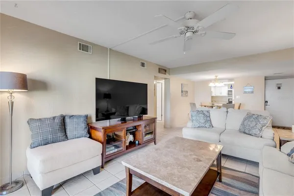 a living room with furniture and a lamp