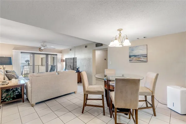 a kitchen with granite countertop white cabinets and appliances