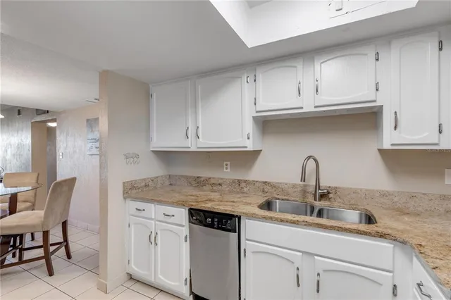 a bedroom with a large bed and a flat screen tv