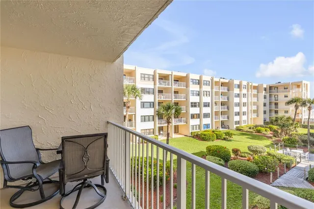 a view of balcony with seating space and potted plants