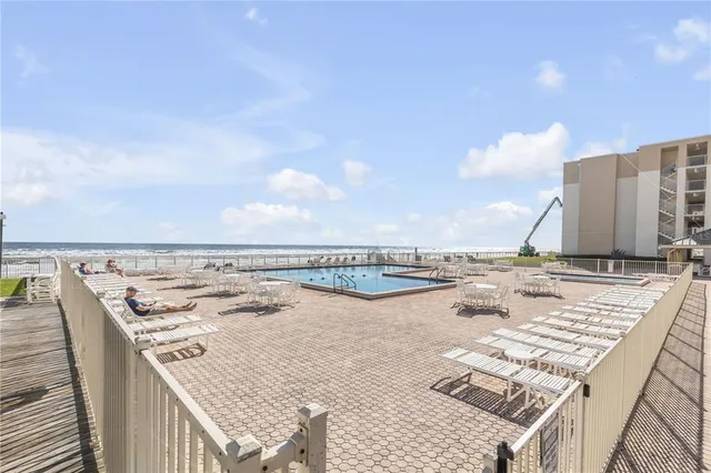 a view of a balcony with chairs