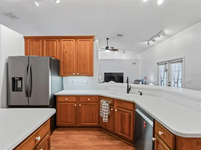 a view of a dining room with furniture and a window