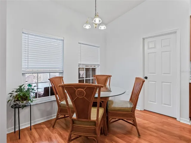 a spacious bathroom with a double vanity sink mirror and bathtub