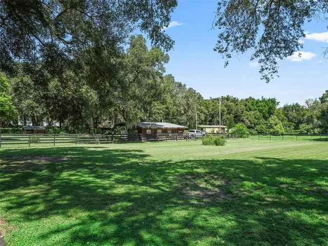 a room with furniture a rug and a window