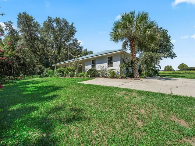 a kitchen with stainless steel appliances wooden floors and wooden cabinets