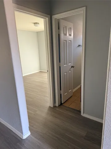 a kitchen with granite countertop a stove and a refrigerator