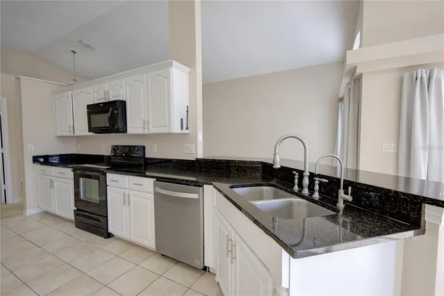 a kitchen with a stove and a microwave