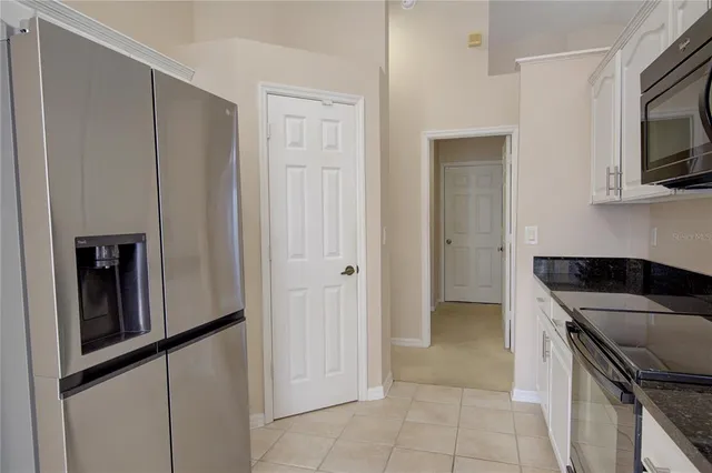 a bedroom with a large bed and a large window