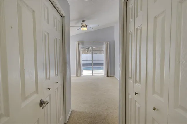 a large bathroom with a granite countertop sink a mirror and a bathtub