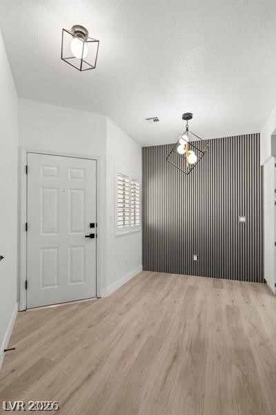 3320 South Fort Apache Road, Unit 125 Las Vegas, NV 89117 - Photo 8 of 26 Clean lines and modern lighting fixtures illuminate this inviting entry space.