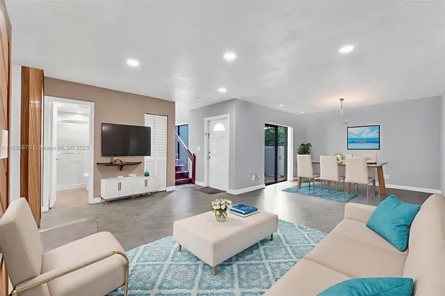 a kitchen with cabinets and a refrigerator