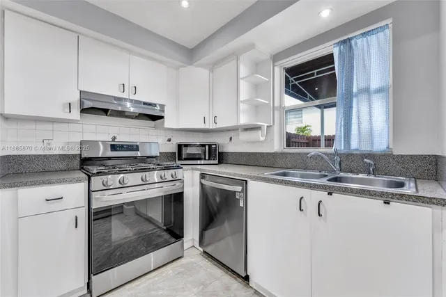 en empty room with sliding glass door and outdoor view