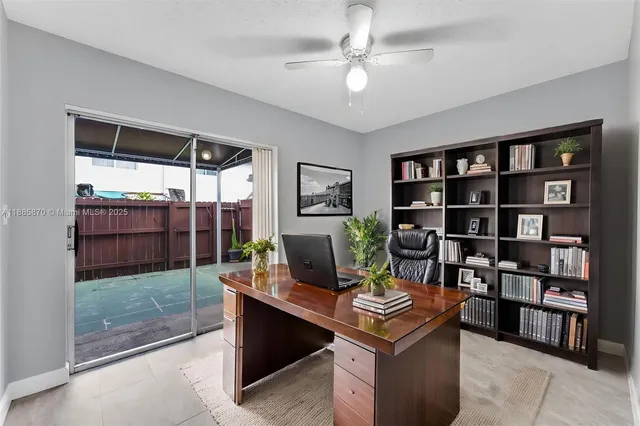 a view of a livingroom with dishwasher & cabinets