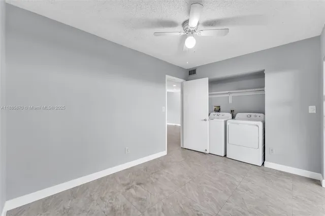a bathroom with a shower sink vanity mirror and toilet