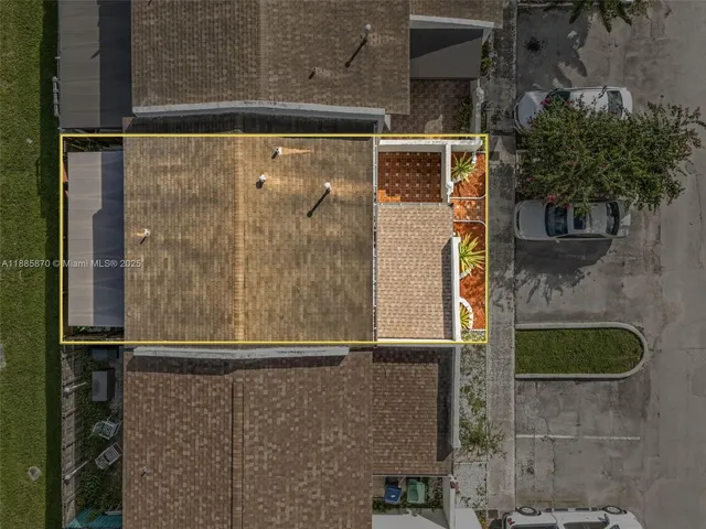 an aerial view of a table and a chairs