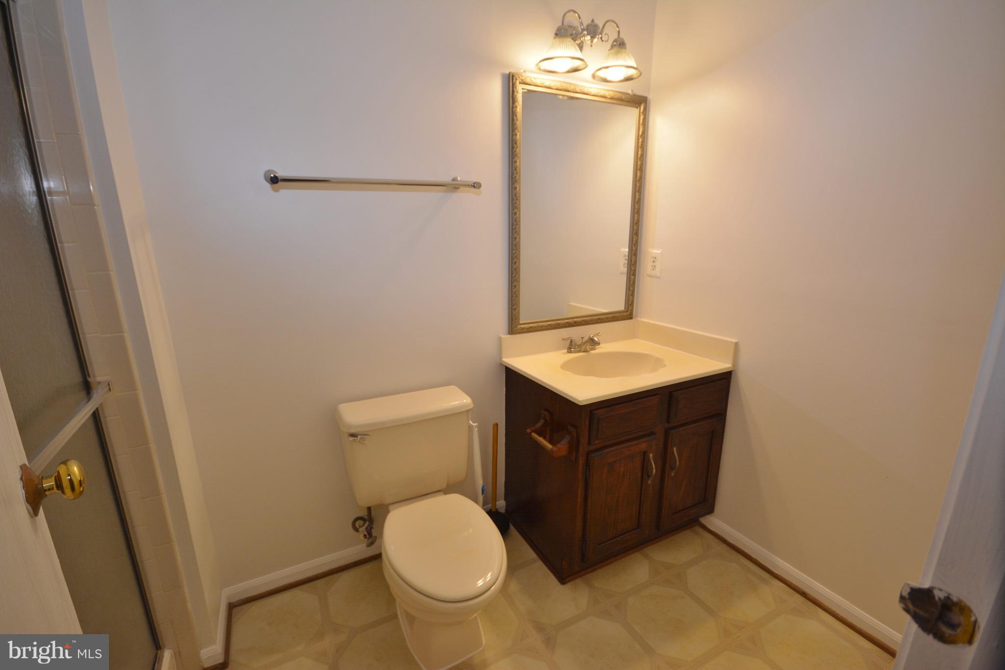 7407 Aspenpark Road Lorton, VA 22079 - Photo 12 of 12 a bathroom with a sink vanity and toilet