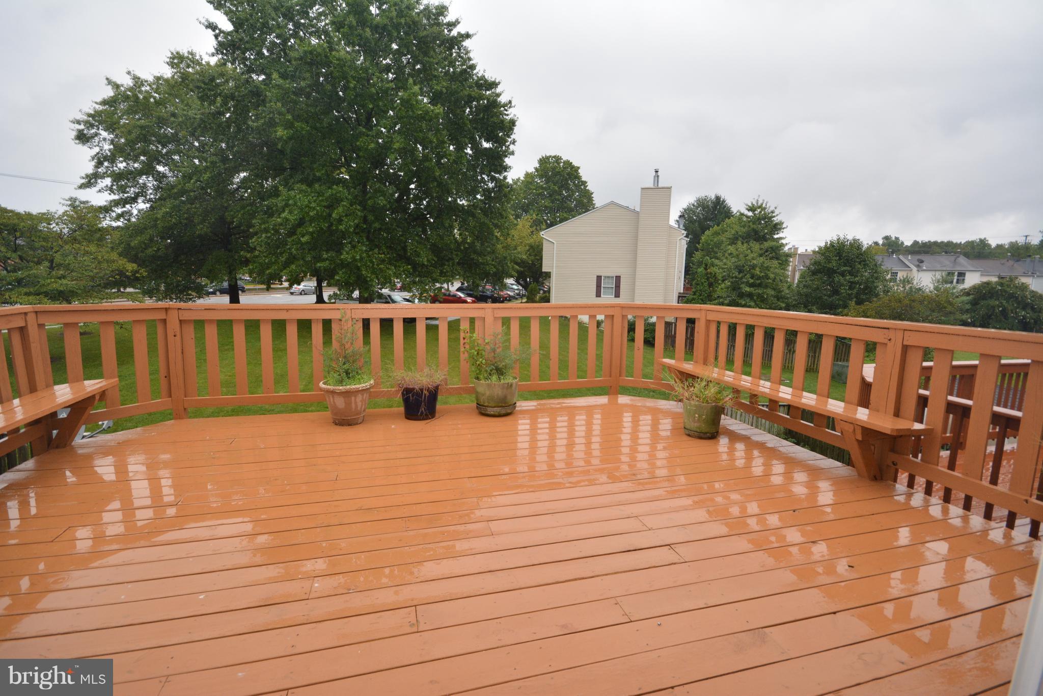 7407 Aspenpark Road Lorton, VA 22079 - Photo 7 of 12 a view of deck with a large swimming pool