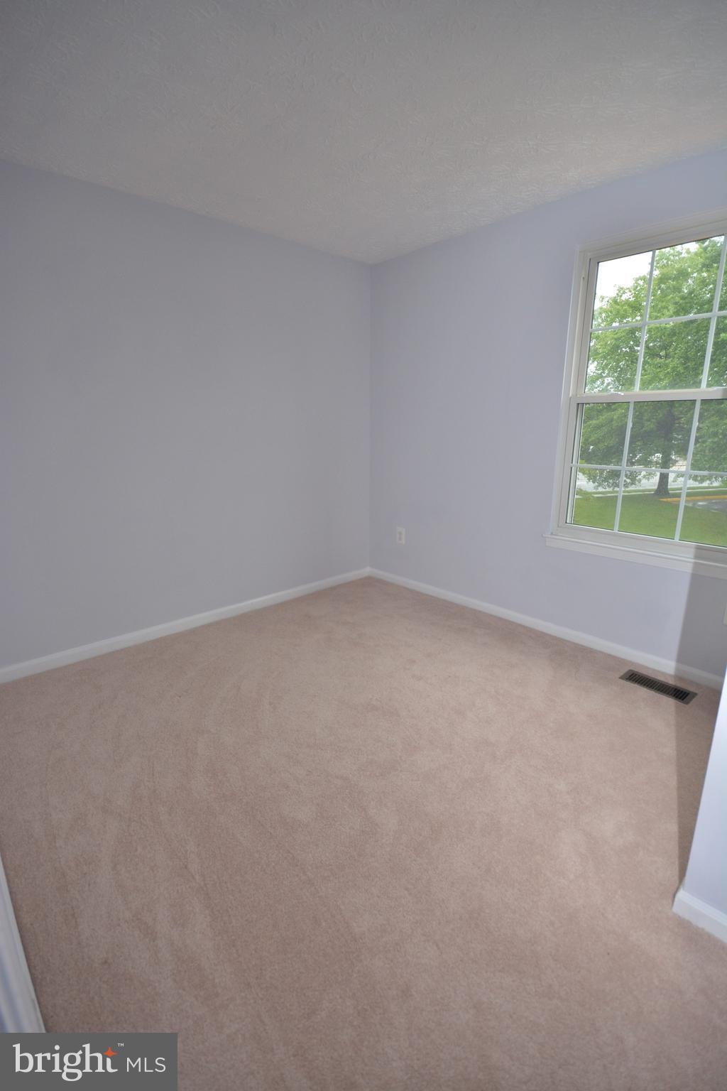 7407 Aspenpark Road Lorton, VA 22079 - Photo 10 of 12 an empty room with a window