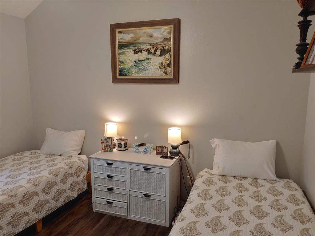 836 Airport Road Reno, TX 75462 - Photo 16 of 30 Neutral-toned walls complement wood-finish flooring