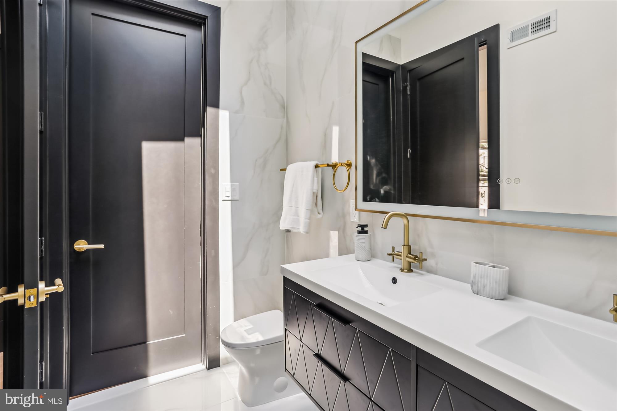 1832 Florida Avenue Northwest Washington, DC 20009 - Photo 11 of 60 a bathroom with a sink and a mirror