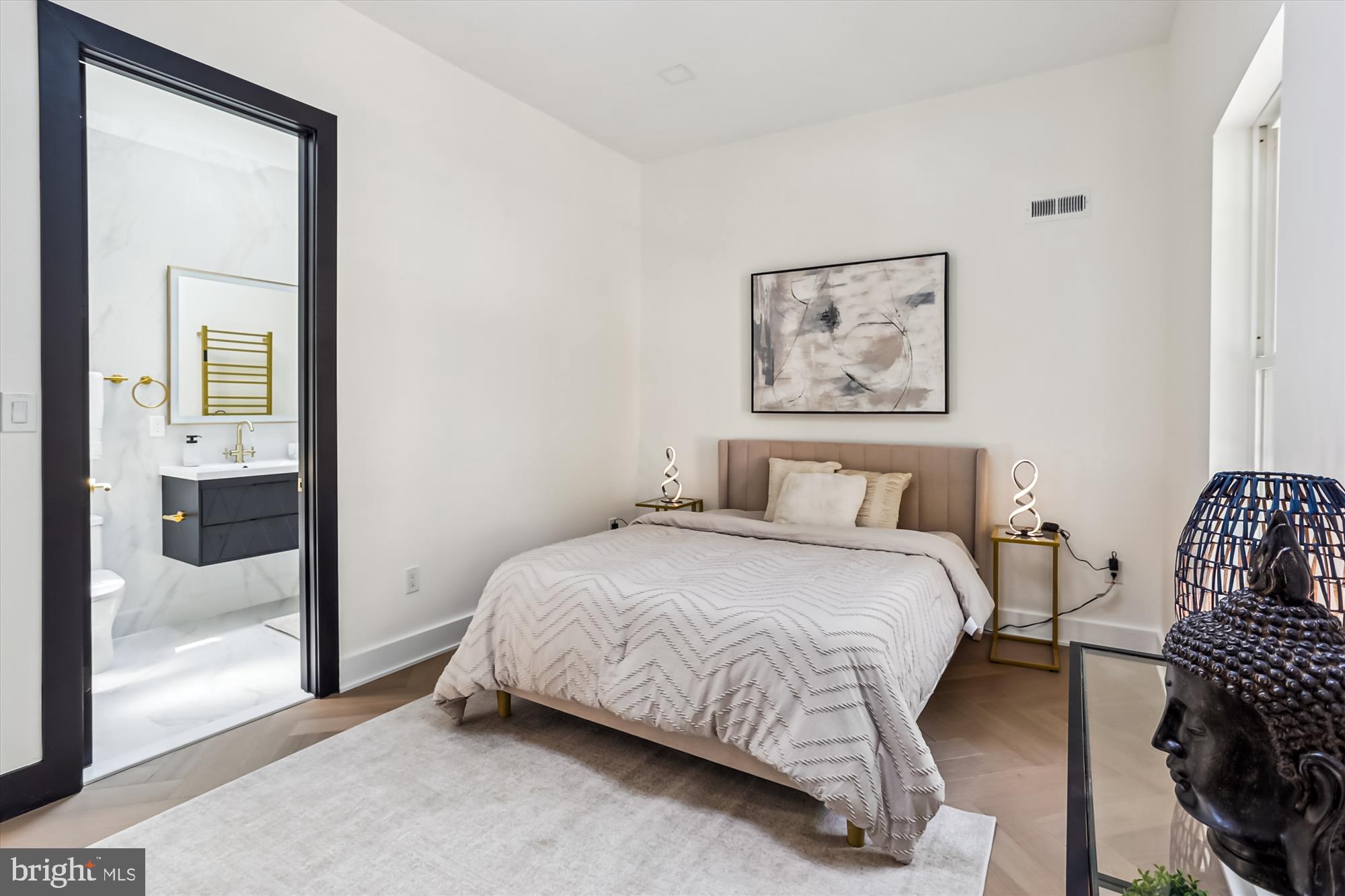 1832 Florida Avenue Northwest Washington, DC 20009 - Photo 13 of 60 a bedroom with a bed and a painting on the wall
