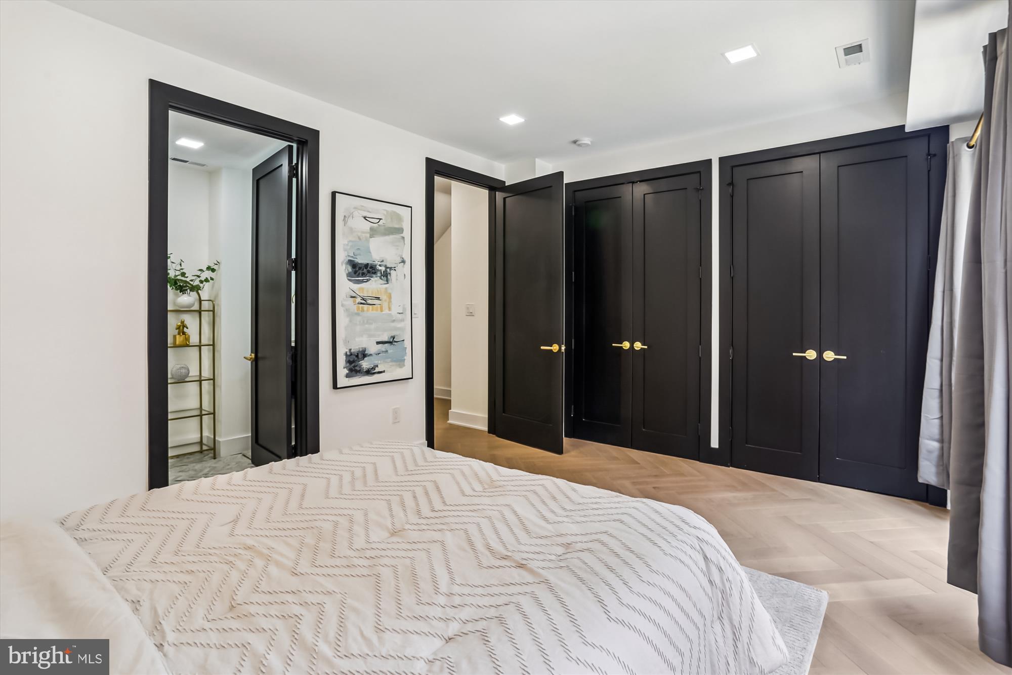 1832 Florida Avenue Northwest Washington, DC 20009 - Photo 26 of 60 a bedroom with a bed and a mirror