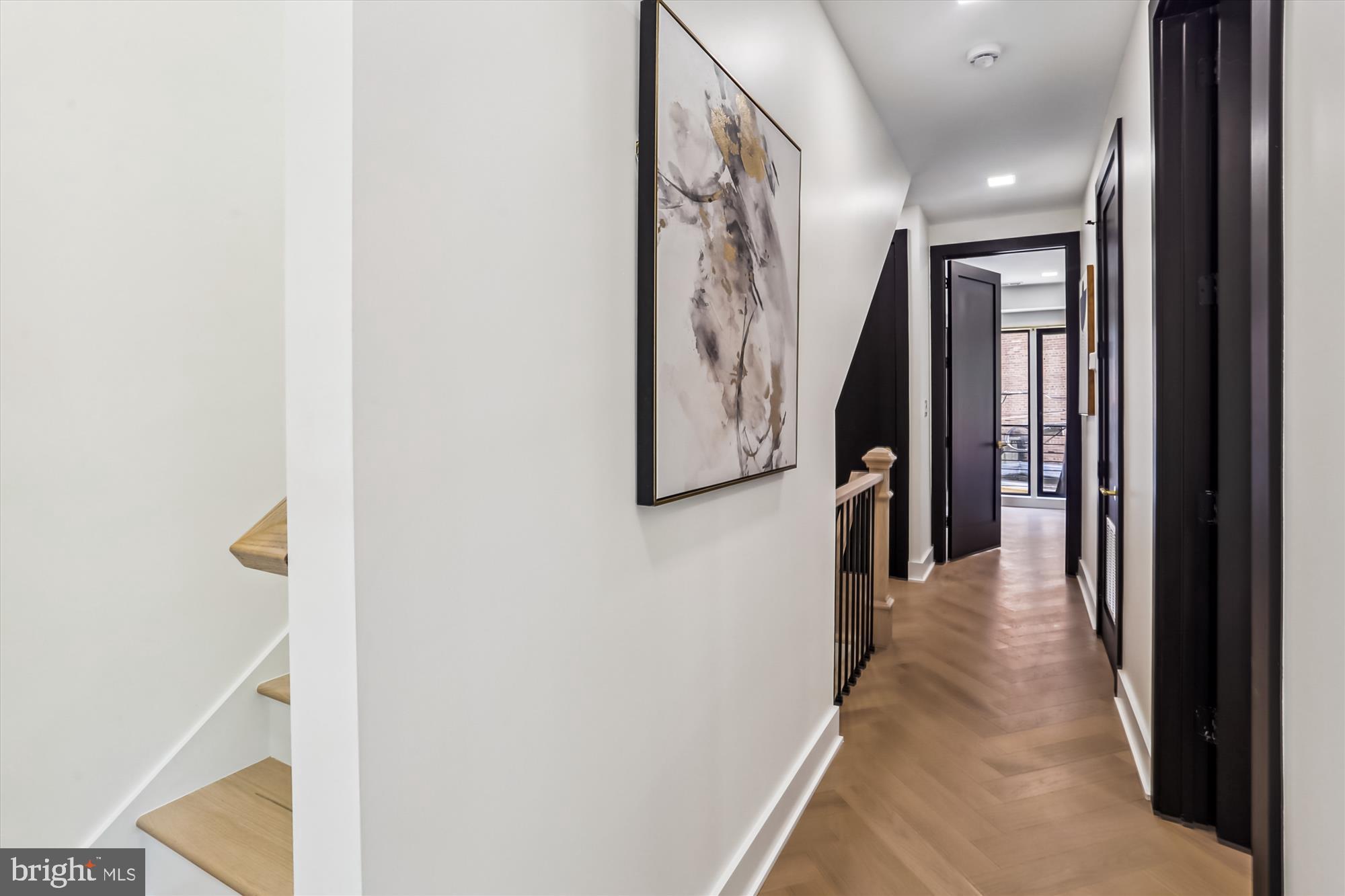 1832 Florida Avenue Northwest Washington, DC 20009 - Photo 28 of 60 a view of a hallway with paintings on the wall
