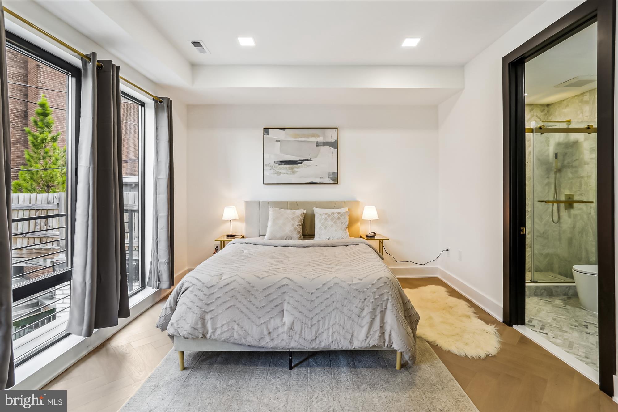 1832 Florida Avenue Northwest Washington, DC 20009 - Photo 31 of 60 a bedroom with a large bed and a large window