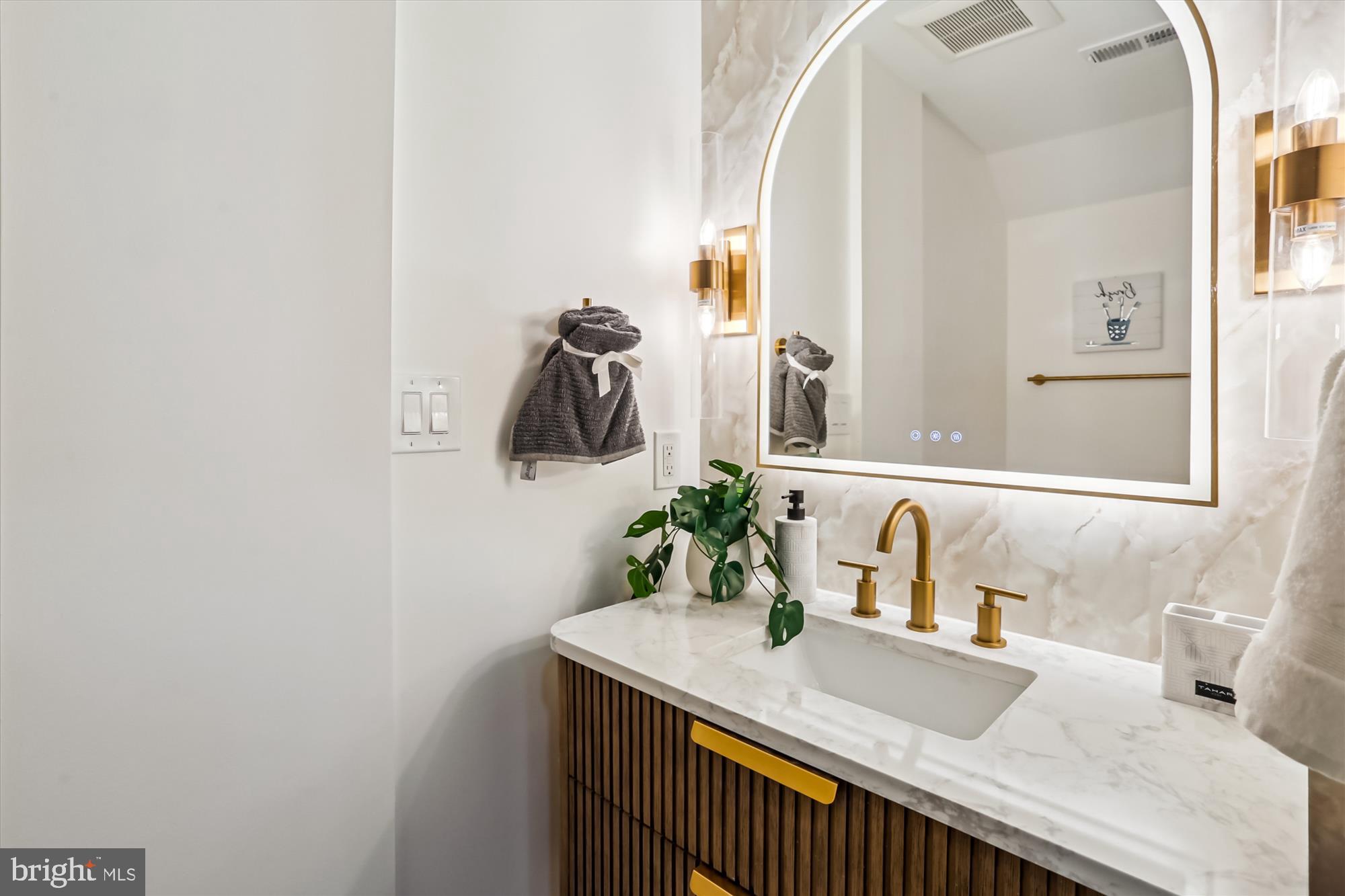 1832 Florida Avenue Northwest Washington, DC 20009 - Photo 8 of 60 a bathroom with a sink and a mirror