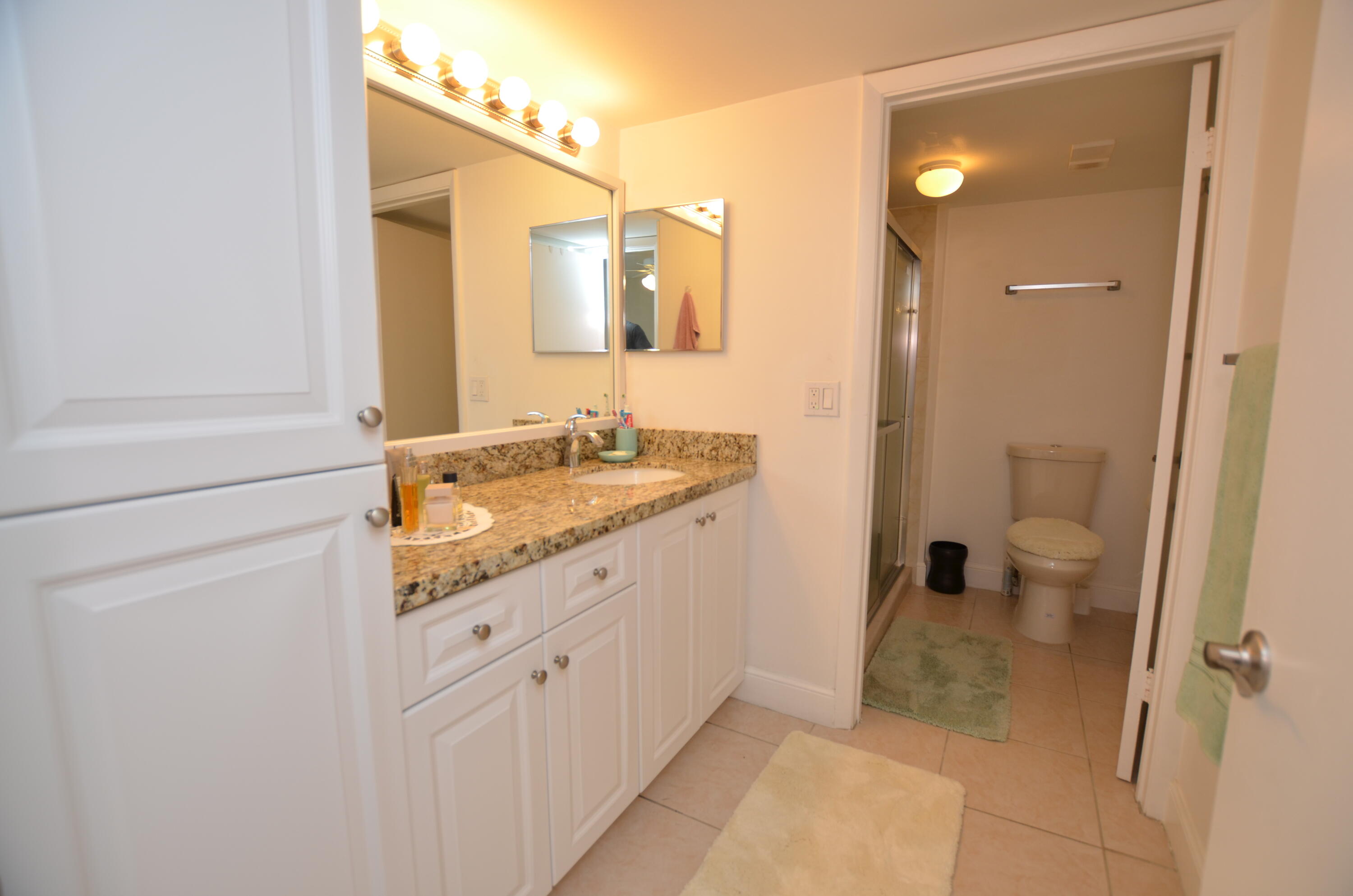 6649 Somerset Drive, Unit 102 Boca Raton, FL 33433 - Photo 12 of 19 a bathroom with a sink and a mirror
