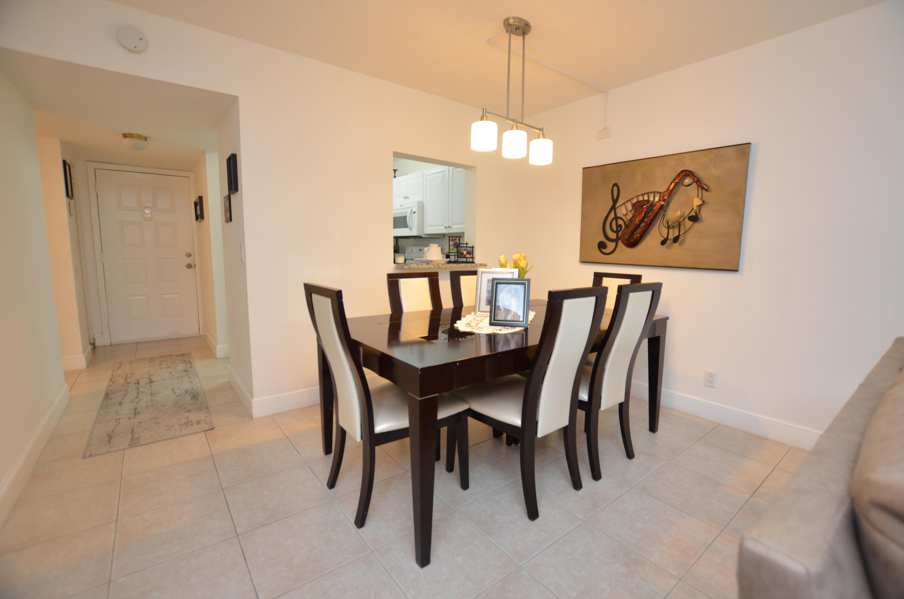 6649 Somerset Drive, Unit 102 Boca Raton, FL 33433 - Photo 5 of 19 a view of a dining room with furniture