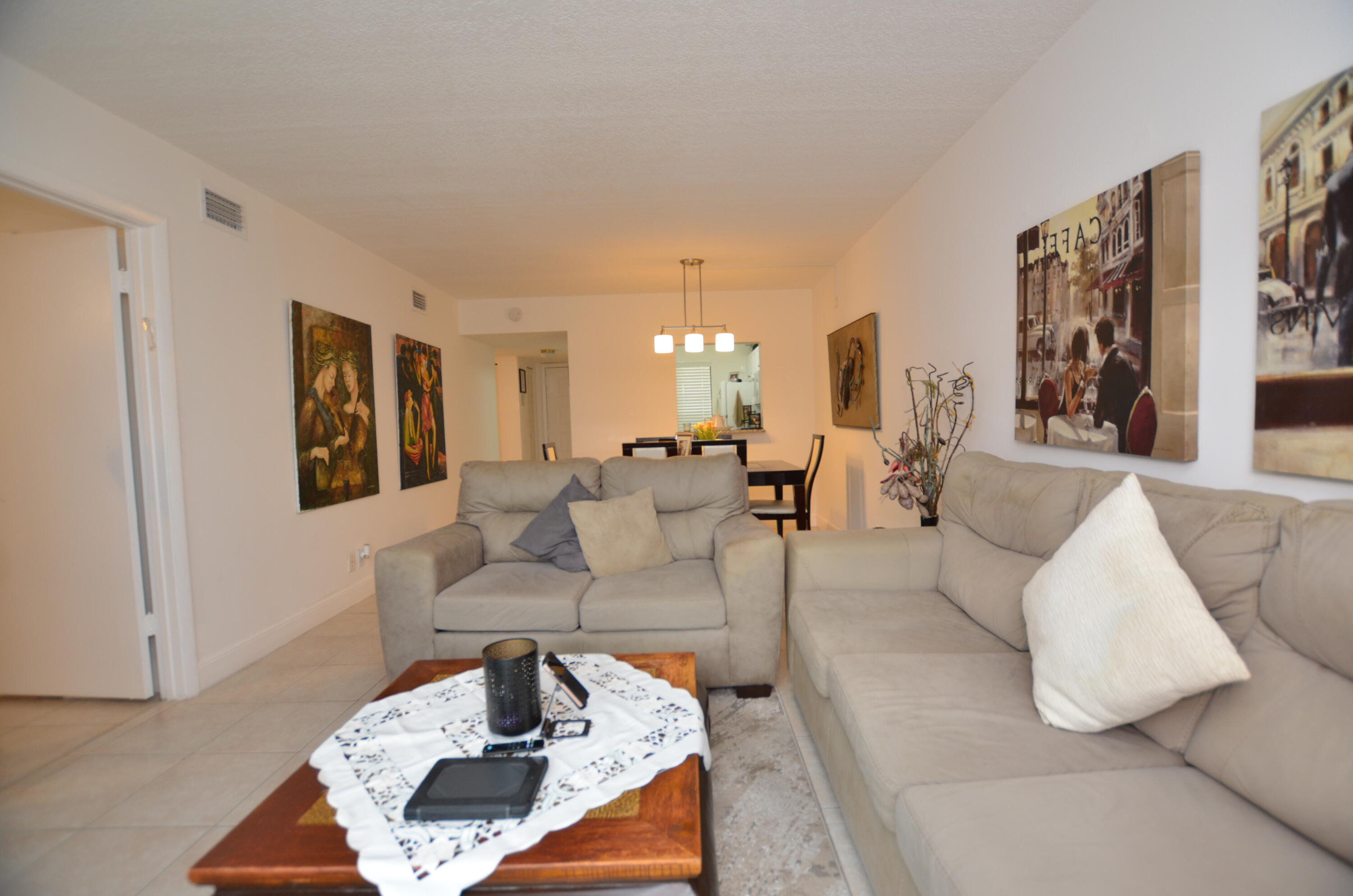6649 Somerset Drive, Unit 102 Boca Raton, FL 33433 - Photo 7 of 19 a living room with furniture and a couch