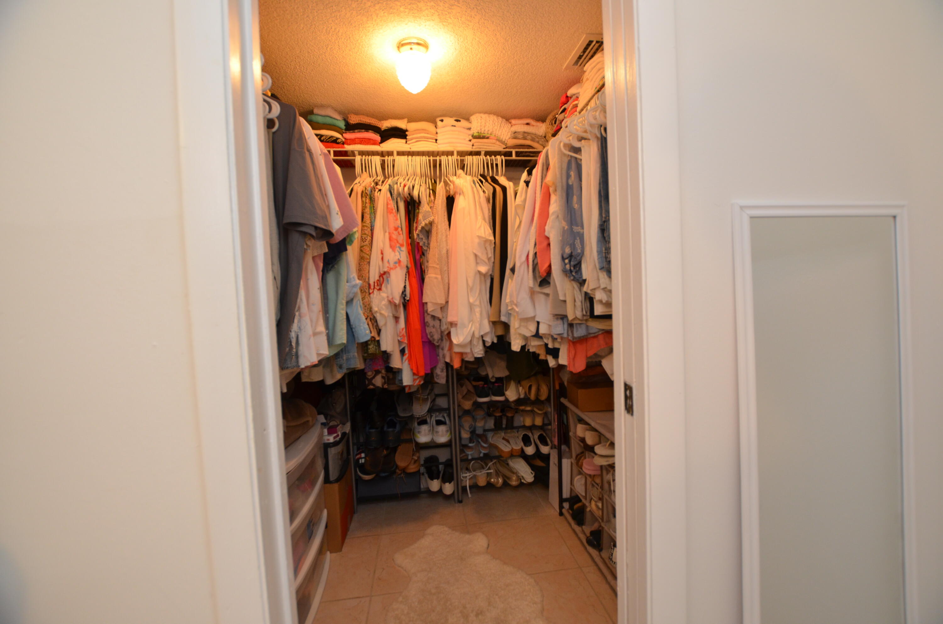 6649 Somerset Drive, Unit 102 Boca Raton, FL 33433 - Photo 10 of 19 a view of walk in closet with clothes