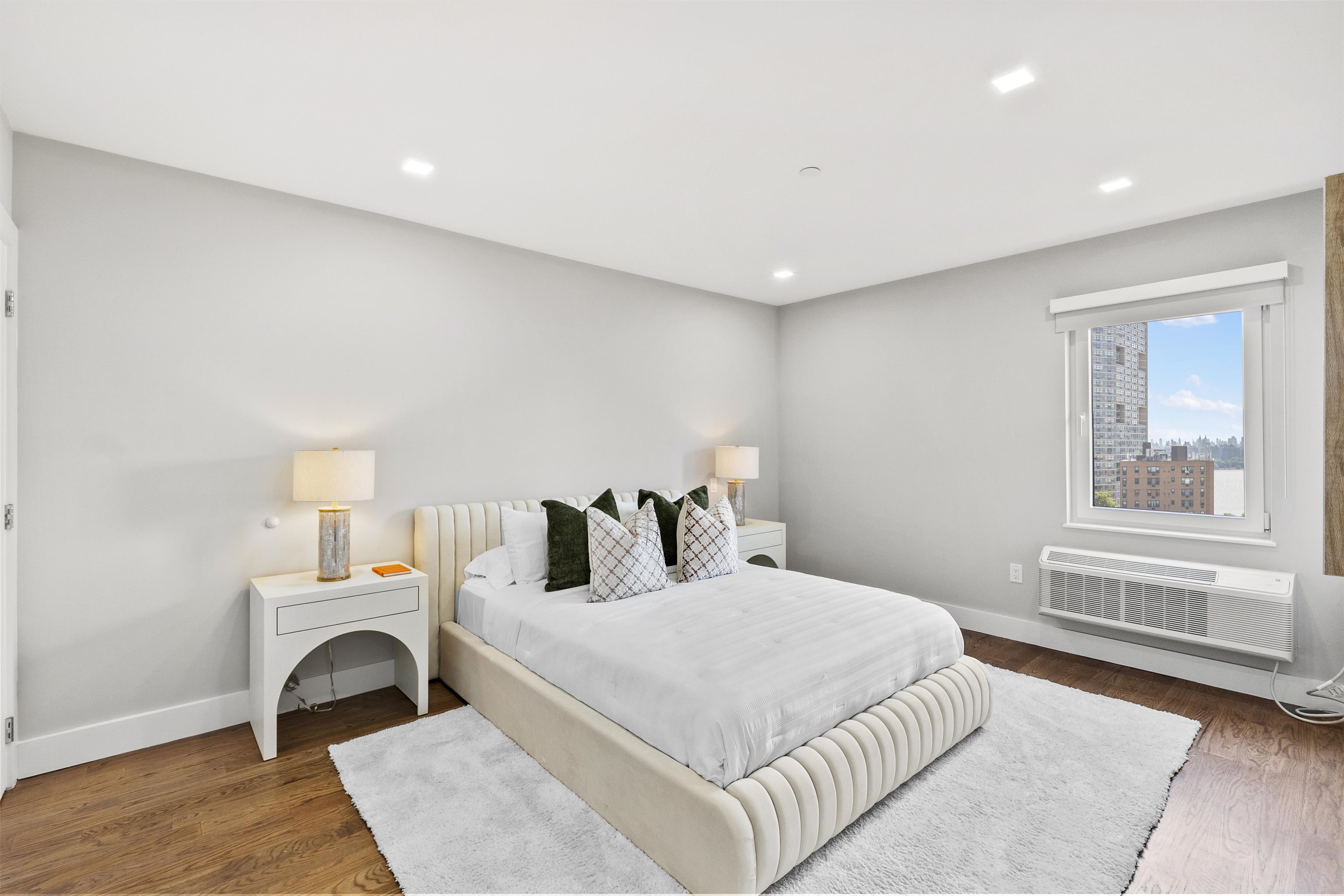 60-64 68th Street, Unit 208 Guttenberg, NJ 07093 - Photo 13 of 29 a bedroom with a bed and a window