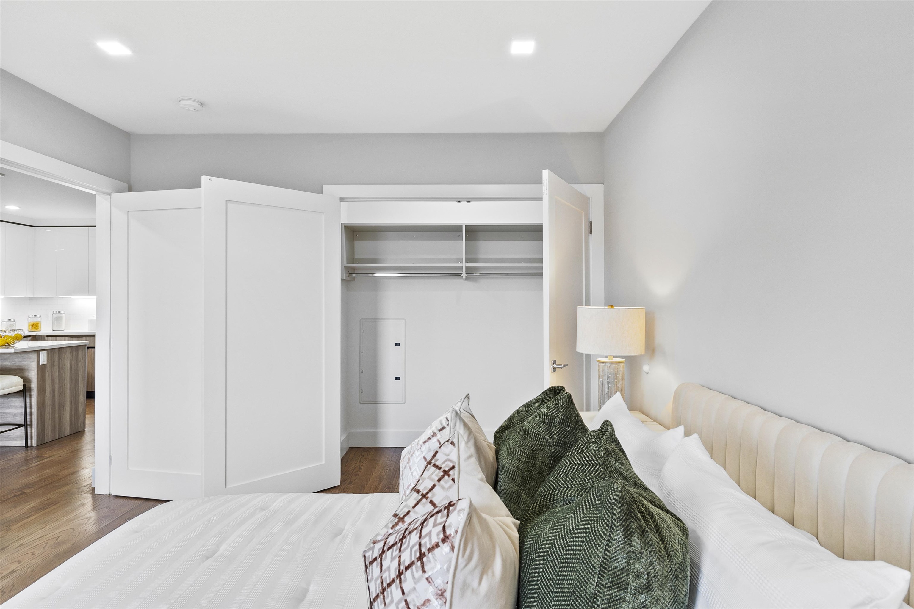 60-64 68th Street, Unit 208 Guttenberg, NJ 07093 - Photo 17 of 29 a bedroom with a bed and a view of kitchen