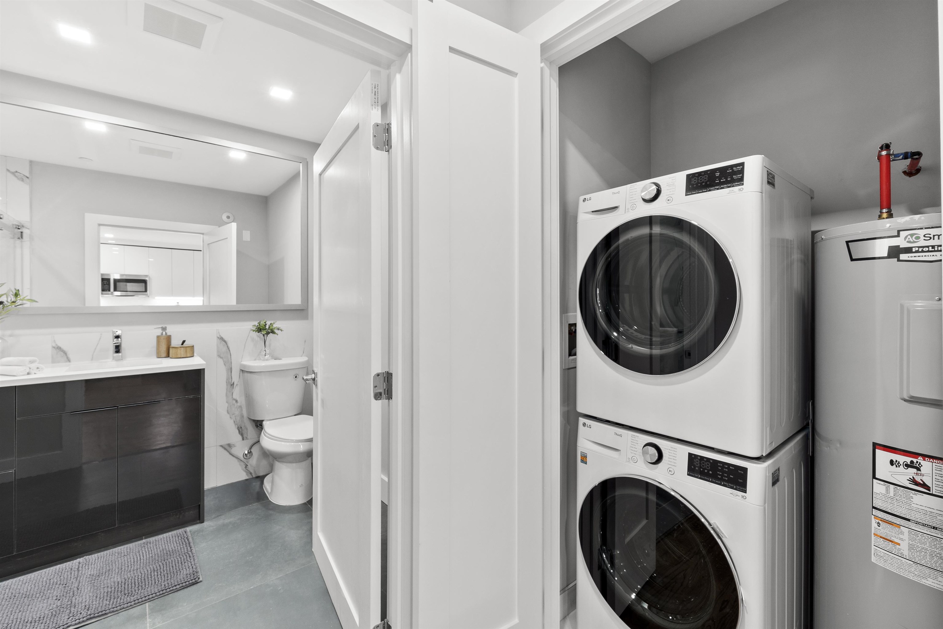 60-64 68th Street, Unit 208 Guttenberg, NJ 07093 - Photo 19 of 29 a view of a hallway with washer and dryer